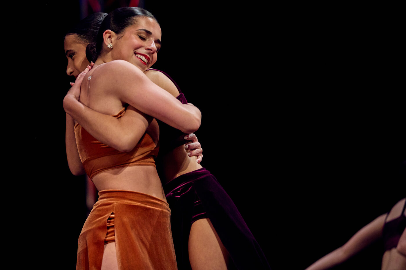 Two AFDS dancers embracing after a routine