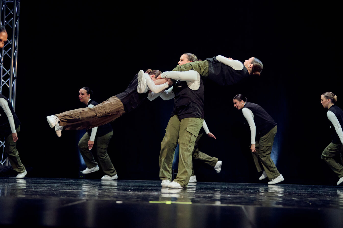 Synergy hip hop team performing a group lift